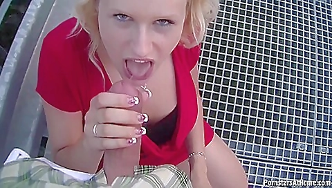 Big tits blonde girl outside of the car with a sexy dress