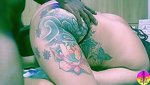 Tattooed ebony woman with a big ass sucking on milk