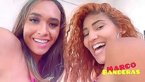 Big-titted redhead and brunette fuck in the bedroom