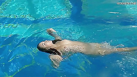 Sexy brunette teen nude in a swimsuit and lingerie under the sea