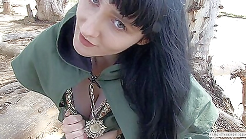 Hot brunette in outdoor solo is playing with a big toy