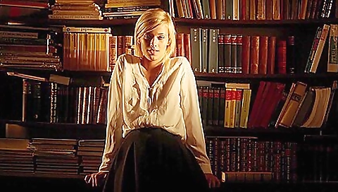 Blonde with a nice round ass and a cute face is on the bed