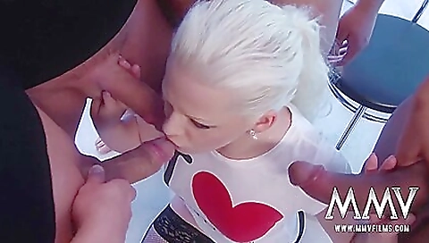 Busty blonde fucks a bunch of men in a blowjob vid