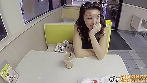 Big-assed brunette is in her pink lingerie on the couch