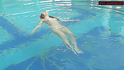 Sexy brunette and hot girl enjoying each other in the water